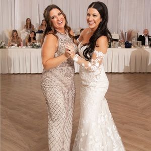 MOB Dress, size 12 gown worn once . Altered to 5’5” height. Sewn in Bra cups .